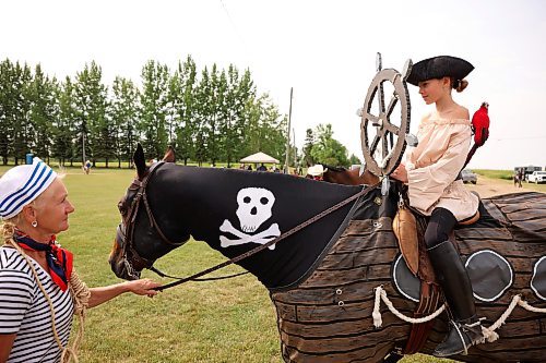 17072025
Ruby McAuley and her granddaughter Leah Miskiman, both of Rocanville, SK, wait with their horse Dundee to compete in a costume class at the Hamiota Fair on Thursday. McAuley and Miskiman placed first in the class. (Tim Smith/The Brandon Sun)