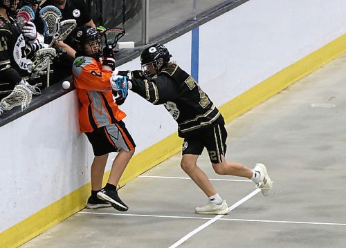 Manitoba's Ari Lang of Brandon (72) drives Alberta Indigenous Baggataway Council's Brody Vandersluys (2) into the boards as the ball goes flying during under-15 boys action at the Prairie Cup at Westoba Place on Friday afternoon. (Perry Bergson/The Brandon Sun)
July 18, 2025