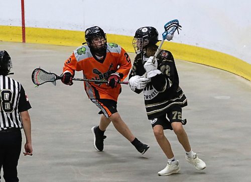 Manitoba's Ari Lang of Brandon (72) carries the ball as Brody Vandersluys (2) of the Alberta Indigenous Baggataway Council defends during under-15 boys action at the Prairie Cup at Westoba Place on Friday afternoon. (Perry Bergson/The Brandon Sun)
July 18, 2025
