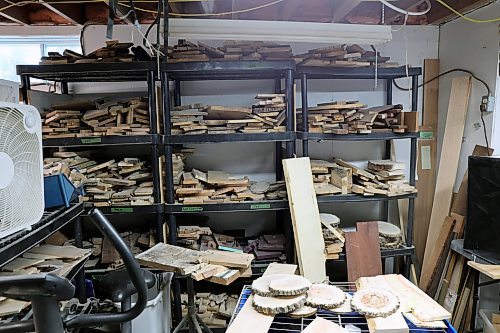 A rack of organized wood types holds the future projects. (Connor McDowell/The Brandon Sun)