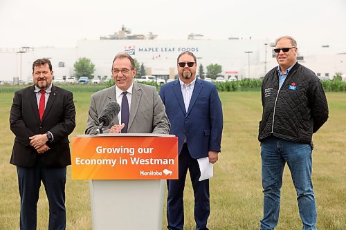 23072025
Agriculture Minister Ron Kostyshyn speaks as Municipal and Northern Relations Minister Glen Simard, Director of Operations for Canada Packers Inc. Rob Ackerblade and Maple Leaf Foods Plant Manager Jim Brown look on during an announcement by the province at Maple Leaf Foods near Brandon on Wednesday. The governments of Manitoba and Canada announced an investment of over $6 million for food processing facilities in Manitoba.
(Tim Smith/The Brandon Sun)
