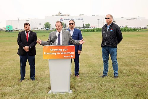 23072025
Agriculture Minister Ron Kostyshyn speaks as Municipal and Northern Relations Minister Glen Simard, Director of Operations for Canada Packers Inc. Rob Ackerblade and Maple Leaf Foods Plant Manager Jim Brown look on during an announcement by the province at Maple Leaf Foods near Brandon on Wednesday. The governments of Manitoba and Canada announced an investment of over $6 million for food processing facilities in Manitoba.
(Tim Smith/The Brandon Sun)
