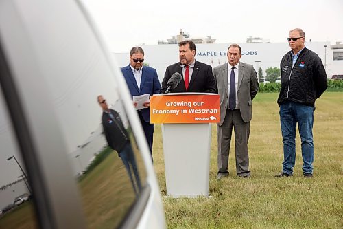 23072025
Municipal and Northern Relations Minister Glen Simard speaks as Agriculture Minister Ron Kostyshyn, Director of Operations for Canada Packers Inc. Rob Ackerblade and Maple Leaf Foods Plant Manager Jim Brown look on during an announcement by the province at Maple Leaf Foods near Brandon on Wednesday. The governments of Manitoba and Canada announced an investment of over $6 million for food processing facilities in Manitoba.
(Tim Smith/The Brandon Sun)