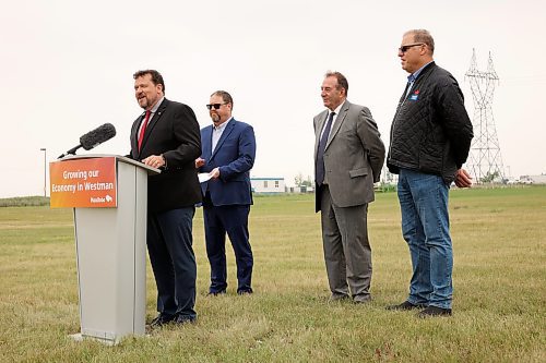 23072025
Municipal and Northern Relations Minister Glen Simard speaks as Agriculture Minister Ron Kostyshyn, Director of Operations for Canada Packers Inc. Rob Ackerblade and Maple Leaf Foods Plant Manager Jim Brown look on during an announcement by the province at Maple Leaf Foods near Brandon on Wednesday. The governments of Manitoba and Canada announced an investment of over $6 million for food processing facilities in Manitoba.
(Tim Smith/The Brandon Sun)