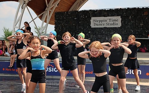 Dancers from Steppin' Time Dance Studio's summer camp perform during a finale for family and friends Thursday afternoon at the Riverbank Discovery Centre. After four days of workshops and instruction, the 80 campers showed off their new routines in tap, jazz, ballet, stage, hip hop and other forms. The camp was open to children aged seven and older with some dance experience preferred. Each group learned six routines during the camp, which took place this week at the dance studio at 132 Ninth St. and was coached by more than 10 instructors. (Michele McDougall/The Brandon Sun) 