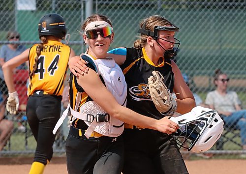 Storm catcher Brynne Shiels embraces pitcher Emerson Kempthorne after they beat the Heat 7-4 the showcase final. (Perry Bergson/The Brandon Sun)