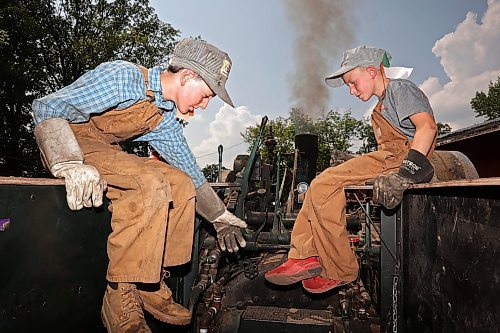 Maxwell Farquhar of Chilliwack, B.C., and Logan Roy of Binscarth run a 110-horsepower Case traction engine. (Tim Smith/The Brandon Sun)