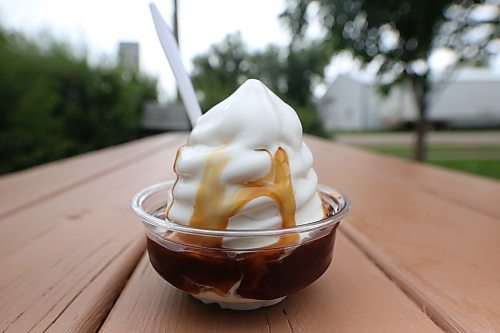A small caramel sundae from Ninette's Hot 'N' Frosty drive in begins to melt on a warm summer Tuesday afternoon. (Matt Goerzen/The Brandon Sun)