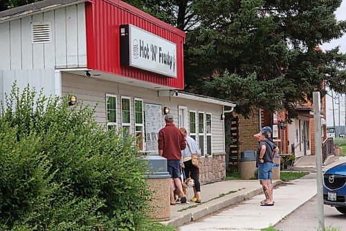Customers wait for their order at the take out window for Hot 'N' Frosty, a summer staple in Ninette, Man. (Matt Goerzen/The Brandon Sun)
