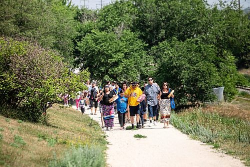 MIKAELA MACKENZIE / FREE PRESS
	
Drummers Felicia Young (left), Johnny Bighetty, and Shyanne Sinclair lead Leaf Rapids evacuees on a walk to gather at Garbage Hill on Thursday, July 24, 2025.

For Nicole sidebar.
Winnipeg Free Press 2025