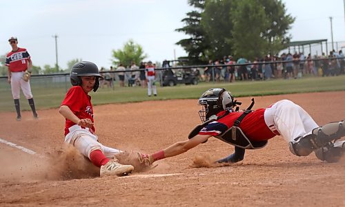 Red River Valley Pioneers Aiden McConnell slides into home plate as South Central Cubs catcher Silas Teichroeb dives to make the tag, drawing an emphatic "out" call from the umpire during under-15 AA baseball provincials at Simplot Millennium Park on Friday. (Thomas Friesen/The Brandon Sun)