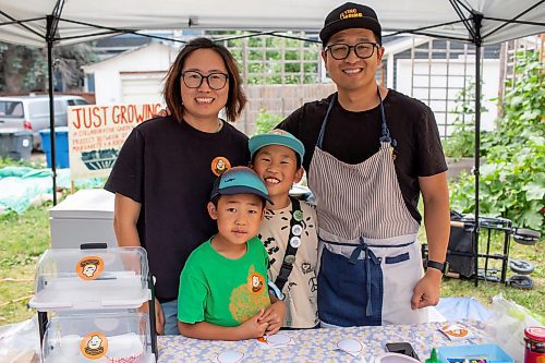 BROOK JONES/FREE PRESS
Aaron Li, who moved to Winnipeg with his family in 2022, markets Chinese dumplings based on family recipes and sells his dumplins at the Wolseley Farmers Market at Saint Margaret's Anglican Church in Winnipeg, Man. Li has a variety of dumplings such as pork with cabbage and chive, tofu with kimchi and beef with carrots and onion. Li, 37, (right) is pictured at his Super Flying Dumpling booth with his wife Ruby Zhao, 36, (left) and their children Jasper Li, 6, (second from far left) and Oscar Li, 8, (second from far right) during the Wolseley Farmers Market Tuesday, July 29, 2025.