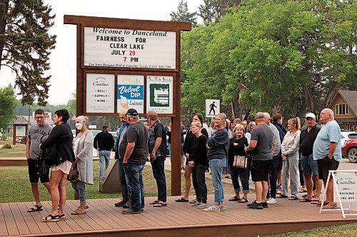 29072025
A large crowd cues to enter Danceland in Wasagaming for the Fairness For Clear Lake town hall regarding the Clear Lake boat ban and Zebra Mussel presence in the lake on Tuesday evening. Hundreds of community members and stakeholders filled Danceland to listen to speakers including experts, politicians and Parks Canada staff, as well as to ask questions. 
(Tim Smith/The Brandon Sun)