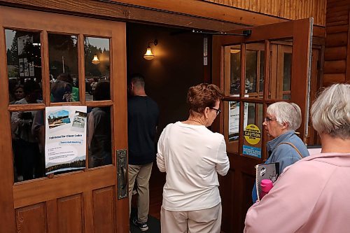 29072025
A large crowd cues to enter Danceland in Wasagaming for the Fairness For Clear Lake town hall regarding the Clear Lake boat ban and Zebra Mussel presence in the lake on Tuesday evening. Hundreds of community members and stakeholders filled Danceland to listen to speakers including experts, politicians and Parks Canada staff, as well as to ask questions. 
(Tim Smith/The Brandon Sun)