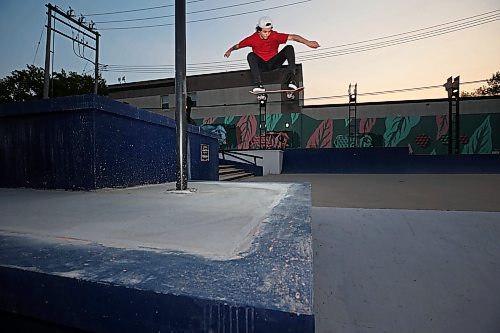 31072025
Lukas Trout ollies a large gap between a newly cemented block at the Kristopher Campbell Memorial Skate Plaza into a bank on Wednesday evening. On Saturday the  Skatepark Graffiti Jam presented by the City of Brandon and Brandon Downtown will take place at the plaza. It will feature music, food, skateboarding and graffiti artists creating murals within the skatepark. 
(Tim Smith/The Brandon Sun)
