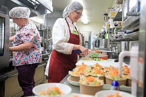 Ruth Bonneville / Free Press
Faith - Gary Ledoux
Photo of Bethania Personal Care Home kitchen staff, Anna Sawatsky (right) and Jaime Groll preparing lunch for their care home residents Friday.
Story on how Winnipeg’s 37 personal care homes provide food that is mass-produced in an off-site commercial kitchen, frozen and then re-heated and distributed to residents. Bethania home has their own on-site kitchen and culinary staff.
See John Longhurst story
Aug 1st, 2025