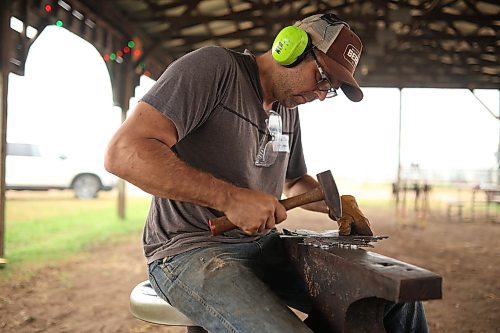 08082025
Chris Spilak works on detailing a maple leaf that will be a part of a collaborative metal sculpture as part of day two of the CanIRON XIV National Blacksmith Conference at the Manitoba Agricultural Museum south of Austin on Friday. Spilak is on the organizing committee for the event. 
(Tim Smith/The Brandon Sun)