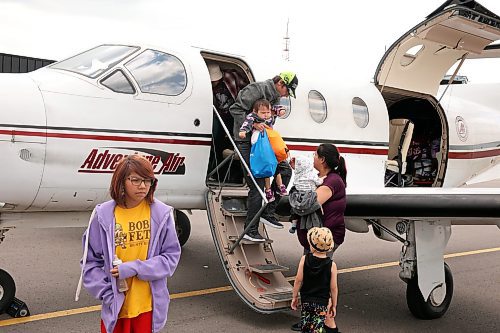 04072025
Trent Farrow, Nikita Moose and their seven children arrive at the Brandon Municipal Airport on Friday afternoon after being evacuated from Lynn Lake, Manitoba due to wildfires threatening the community. This is the second time this summer that Lynn Lake has been evacuated. (Tim Smith/The Brandon Sun