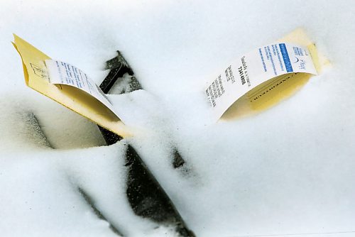 One of thousands of parking tickets- This one on Leo Novak St- the City Of Winnipeg wrote during this weekends residential parking ban–Standup Photo- Feb 17, 2015 (JOE BRYKSA / WINNIPEG FREE PRESS)