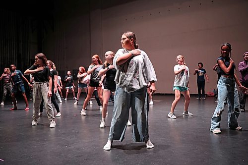 12082025
Twelve and thirteen-year-old kids in the senior dance class at Mecca Productions summer camp practice choreography for the song Where I Want To Be at the Western Manitoba Centennial Auditorium on Tuesday. On Friday afternoon, the over 170 students in the camp, between the ages of 6-18, will perform for family at the auditorium. Tickets for the 2:30PM performance can be purchased through the WMCA.
(Tim Smith/The Brandon Sun)