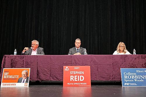 13082025
Ray Berthelette of the NDP speaks as Colleen Robbins of the PC Party of Manitoba and Stephen Reid of the Manitoba Liberal Party listen during the Souris &amp; Glenwood Chamber of Commerce byelection debate at the Avalon Theatre in Souris on Wednesday evening. 
(Tim Smith/The Brandon Sun)