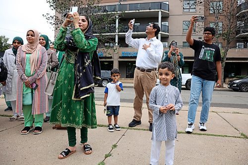 14082025
Members of Brandon’s Pakistani community take photos as the Pakistan flag is raised at Brandon City Hall on Thursday to celebrate Pakistan’s Independence Day.
(Tim Smith/The Brandon Sun)