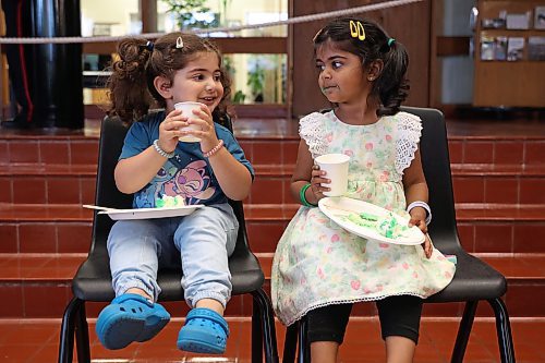 14082025
Cousins Abeera Akram and Irha Rehman enjoy cake during a celebration honouring Pakistan’s Independence Day at Brandon City Hall on Thursday.
(Tim Smith/The Brandon Sun)
