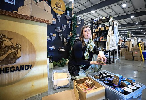 RUTH BONNEVILLE / FREE PRESS
Local - Postal Strike and makers
Photo of soap maker, Leiah Bauer, who runs a small business called fApothecandy, sets up her booth at the Third + Bird Market Thursday.
Local makers are among those feeling the weight of the Canada Post strike, which is heading into its first full week out of service. Leiah Bauer, a soap maker from rural Manitoba, is overstocking her booth for this weekend's Third + Bird market as she's had to turn off her shipping option on her online shop. The maker relies on Canada Post to ship her product since she doesn't live in a city centre where many makers offer local pick up, and she can't afford to pay for costly delivery alternatives.
Reporter: Nicole Buffie
Nov 21st, 2024