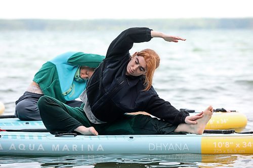 15082025
Emerson Zilkey takes part in a paddleboard Yin yoga class on Clear Lake at Spruces in Riding Mountain National Park with fellow yoga enthusiasts on Friday morning. A crystal sound bowl class was held on land following the yoga. The classes, offered by Paddle Bros, run four days a week for one more week and three classes were scheduled for Friday. Summer classes began at Minnedosa Lake but moved up to Clear Lake after the water advisory was issued At Minnedosa.
(Tim Smith/The Brandon Sun)