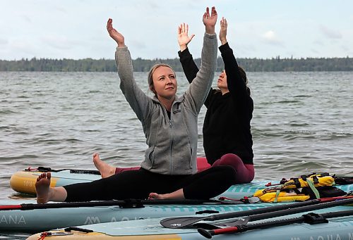 15082025
Riley Jonasson and Alyssa Fardoe part in a paddleboard Yin yoga class on Clear Lake at Spruces in Riding Mountain National Park with fellow yoga enthusiasts on Friday morning. A crystal sound bowl class was held on land following the yoga. The classes, offered by Paddle Bros, run four days a week for one more week and three classes were scheduled for Friday. Summer classes began at Minnedosa Lake but moved up to Clear Lake after the water advisory was issued At Minnedosa.
(Tim Smith/The Brandon Sun)15082025
Barb Patten (L) leads a paddleboard Yin yoga class on Clear Lake at Spruces in Riding Mountain National Park for yoga enthusiasts including Charlotte Garlinski on Friday morning. A crystal sound bowl class was held on land following the yoga. The classes, offered by Paddle Bros, run four days a week for one more week and three classes were scheduled for Friday. Summer classes began at Minnedosa Lake but moved up to Clear Lake after the water advisory was issued At Minnedosa.
(Tim Smith/The Brandon Sun)