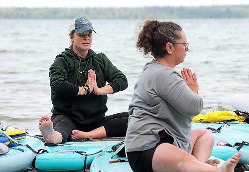 15082025
Barb Patten (L) leads a paddleboard Yin yoga class on Clear Lake at Spruces in Riding Mountain National Park for yoga enthusiasts including Charlotte Garlinski on Friday morning. A crystal sound bowl class was held on land following the yoga. The classes, offered by Paddle Bros, run four days a week for one more week and three classes were scheduled for Friday. Summer classes began at Minnedosa Lake but moved up to Clear Lake after the water advisory was issued At Minnedosa.
(Tim Smith/The Brandon Sun)