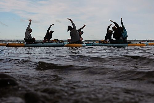 15082025
Yoga enthusiasts take part in a paddleboard Yin yoga class on Clear Lake at Spruces in Riding Mountain National Park on Friday morning. A crystal sound bowl class was held on land following the yoga. The classes, offered by Paddle Bros, run four days a week for one more week and three classes were scheduled for Friday. Summer classes began at Minnedosa Lake but moved up to Clear Lake after the water advisory was issued At Minnedosa.
(Tim Smith/The Brandon Sun)