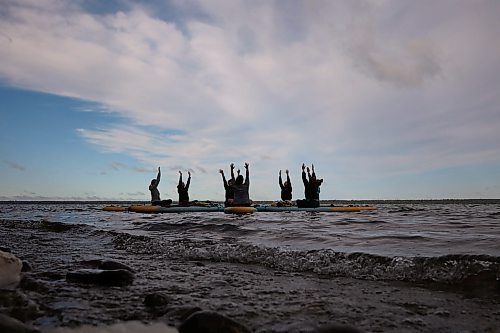 15082025
Yoga enthusiasts take part in a paddleboard Yin yoga class on Clear Lake at Spruces in Riding Mountain National Park on Friday morning. A crystal sound bowl class was held on land following the yoga. The classes, offered by Paddle Bros, run four days a week for one more week and three classes were scheduled for Friday. Summer classes began at Minnedosa Lake but moved up to Clear Lake after the water advisory was issued At Minnedosa.
(Tim Smith/The Brandon Sun)