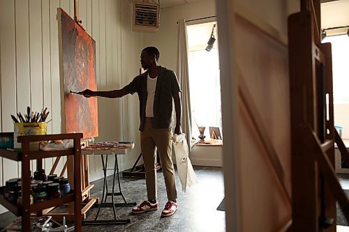 12082025
Artist Opeyemi Olukotun paints in his studio in downtown Brandon in August.
(Tim Smith/The Brandon Sun)