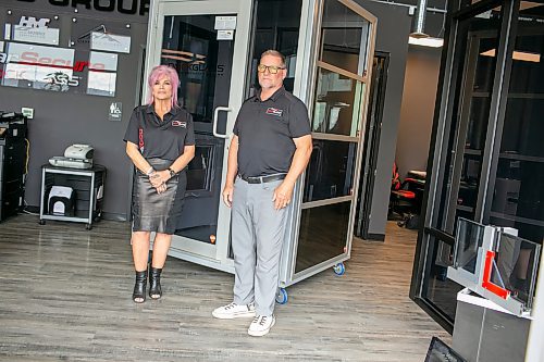 BROOK JONES/FREE PRESS
CearSecure Manufacturing &amp; Distribution is best known for RockGlass, a window security system through impact-resistant windows and doors. The local company is located in CentrePort Canada at 8-3149 Red Fife Rd. in the RM of Rosser, Man. ClearSecure President Colleen Munro (left) and ClearSecure Vice-President Vince Croker are pictured in front of one of their impact-resistant doors and windows at their manufacturing and distribution plant on Tuesday, Aug. 19, 2025.