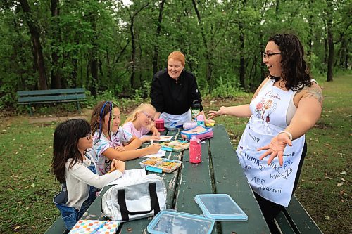 Ruth Bonneville / Free Press
ENT - Lunchbox Chopped
Photo of chefs, Sophie Fiola (lright) and Sharron Park presenting their lunches.
Photos for a feature on 3 local chefs presenting their lunchbox for 3 children to taste test and judge. The kids and chefs met at a picnic table at Assiniboine Park for the lunchbox taste-testing event.
Names Children taste testing in photos. (First names only)
Blonde child with glasses: Paislee, 8
Dark brown hair,, overalls, glasses Faith, 9
Child with colourful braids: Aria, 10
Names of Chefs + lunches:
1. Sophie Fiola (white apron) - Chicken, bean and corn taquitos with salsa and guacamole, served with a side of carrots and sweet peas, with a horchata-inspired rice pudding for dessert
2. Sharron Park - red lentil buns and WAITING ON THE SOUP DETAILS with seasonal fruit crumble
3. Elisa de Jesus – she was not at the shoot but she made a lunch which was red lentil fritters with quinoa salad and oatmeal raisin cookies
The story is for Weds 27 August.
See AV Kitching for more info and story
Aug 11th, 2025