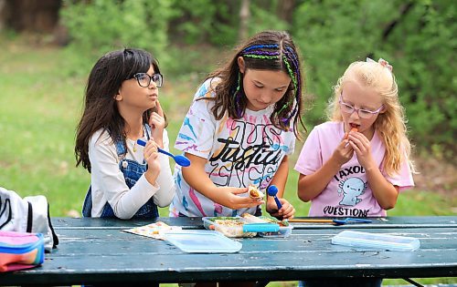 Ruth Bonneville / Free Press
ENT - Lunchbox Chopped
Photo of kids taste testing the lunches.
Dark brown hair,, overalls, glasses Faith, 9
Child with colourful braids: Aria, 10
Blonde child with glasses: Paislee, 8
Photos for a feature on 3 local chefs presenting their lunchbox for 3 children to taste test and judge. The kids and chefs met at a picnic table at Assiniboine Park for the lunchbox taste-testing event.
Names Children taste testing in photos. (First names only)
Blonde child with glasses: Paislee, 8
Dark brown hair,, overalls, glasses Faith, 9
Child with colourful braids: Aria, 10
Names of Chefs + lunches:
1. Sophie Fiola (white apron) - Chicken, bean and corn taquitos with salsa and guacamole, served with a side of carrots and sweet peas, with a horchata-inspired rice pudding for dessert
2. Sharron Park - red lentil buns and WAITING ON THE SOUP DETAILS with seasonal fruit crumble
3. Elisa de Jesus – she was not at the shoot but she made a lunch which was red lentil fritters with quinoa salad and oatmeal raisin cookies
The story is for Weds 27 August.
See AV Kitching for more info and story
Aug 11th, 2025