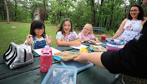 Ruth Bonneville / Free Press 

ENT - Lunchbox Chopped

Photos for a feature on 3 local chefs presenting their lunchbox for 3 children to taste test and judge.  The kids and chefs met at a picnic table at Assiniboine Park for the lunchbox taste-testing event. 


Names Children taste testing in photos. (First names only)

Blonde child with glasses: Paislee, 8
Dark brown hair,, overalls, glasses  Faith, 9
Child with colourful braids: Aria, 10


Names of  Chefs + lunches:

1. Sophie Fiola (white apron) - Chicken, bean and corn taquitos with salsa and guacamole, served with a side of carrots and sweet peas, with a horchata-inspired rice pudding for dessert 

2. Sharron Park - red lentil buns and WAITING ON THE SOUP DETAILS with seasonal fruit crumble

3. Elisa de Jesus – she was not at the shoot but she made a lunch which was red lentil fritters with quinoa salad and oatmeal raisin cookies

The story is for Weds 27 August.

See AV Kitching for more info and  story


Aug 11th,  2025