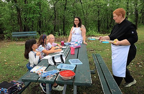 Ruth Bonneville / Free Press 

ENT - Lunchbox Chopped

Photo of chefs, Sophie Fiola (left) and Sharron Park presenting their lunches. 

Photos for a feature on 3 local chefs presenting their lunchbox for 3 children to taste test and judge.  The kids and chefs met at a picnic table at Assiniboine Park for the lunchbox taste-testing event. 


Names Children taste testing in photos. (First names only)

Blonde child with glasses: Paislee, 8
Dark brown hair,, overalls, glasses  Faith, 9
Child with colourful braids: Aria, 10


Names of  Chefs + lunches:

1. Sophie Fiola (white apron) - Chicken, bean and corn taquitos with salsa and guacamole, served with a side of carrots and sweet peas, with a horchata-inspired rice pudding for dessert 

2. Sharron Park - red lentil buns and WAITING ON THE SOUP DETAILS with seasonal fruit crumble

3. Elisa de Jesus – she was not at the shoot but she made a lunch which was red lentil fritters with quinoa salad and oatmeal raisin cookies

The story is for Weds 27 August.

See AV Kitching for more info and  story


Aug 11th,  2025