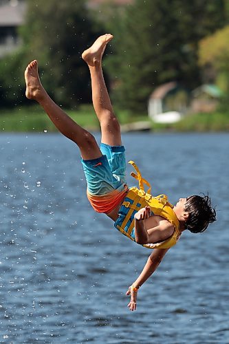 21082025
Jon Kirk is catapulted into the air above Minnedosa Lake while playing with family and friends at the Splish Splash Water Park on the lake on Thursday.
(Tim Smith/The Brandon Sun)