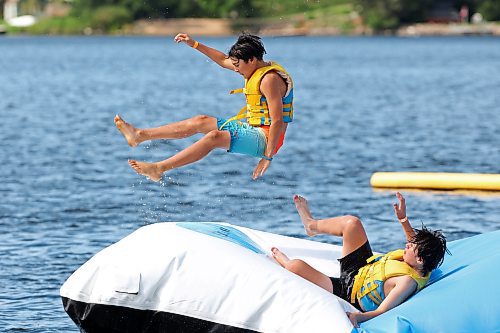 21082025
Jon Kirk is catapulted into the air above Minnedosa Lake by friend Charlie Finnie at the Splish Splash Water Park on the lake on Thursday.
(Tim Smith/The Brandon Sun)