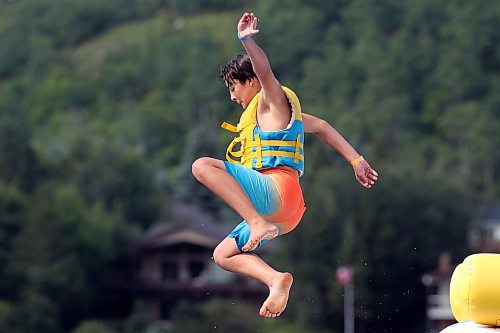 21082025
Jon Kirk leaps off the top of a tower into Minnedosa Lake at the Splish Splash Water Park on the lake on Thursday.
(Tim Smith/The Brandon Sun)