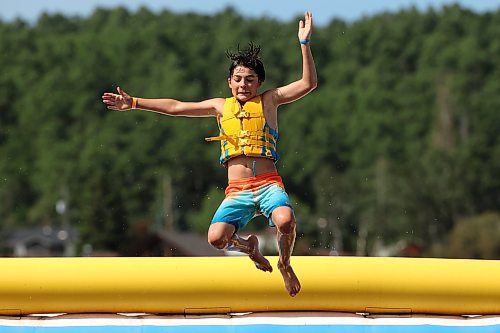 21082025
Jon Kirk leaps off the top of a tower into Minnedosa Lake at the Splish Splash Water Park on the lake on Thursday.
(Tim Smith/The Brandon Sun)
