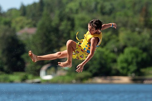 21082025
Jack Kirk is catapulted into the air above Minnedosa Lake while playing with family and friends at the Splish Splash Water Park on the lake on Thursday.
(Tim Smith/The Brandon Sun)