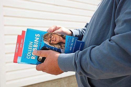 22082025
Volunteer Duncan Hamilton, carries flyers while door knocking with Manitoba Progressive Conservative candidate Colleen Robbins in Spruce Woods on Friday ahead of Tuesday’s Spruce Woods byelection. (Tim Smith/The Brandon Sun)