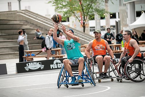BROOK JONES/FREE PRESS
The Canadian Elite Basketball League is hosting a three-day fan-focused street festival as part of the 2025 Championship Weekend at True North Square and on Graham Avenue between Edmonton St. and Donald St. Pictured: SOS team player Bryce McDonald, who is the director of Peg City Basketball, reaches up for the ball during a game of 3x3 wheelchair basketball against Josh's Jaguars as part of the street festival at True North Square in Winnipeg, Man., Friday, Aug. 22, 2025.