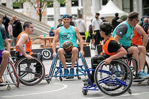 BROOK JONES/FREE PRESS
The Canadian Elite Basketball League is hosting a three-day fan-focused street festival as part of the 2025 Championship Weekend at True North Square and on Graham Avenue between Edmonton St. and Donald St. Pictured: SOS team player Bryce McDonald, who is the director of Peg City Basketball, controls the ball during a game of 3x3 wheelchair basketball against Josh's Jaguars as part of the street festival at True North Square in Winnipeg, Man., Friday, Aug. 22, 2025.