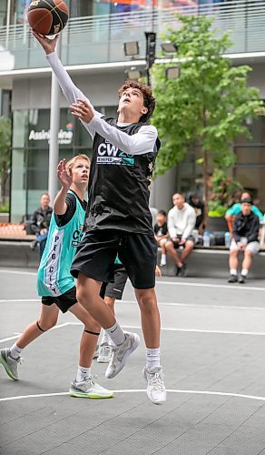 BROOK JONES/FREE PRESS
The Canadian Elite Basketball League is hosting a three-day fan-focused street festival as part of the 2025 Championship Weekend at True North Square and on Graham Avenue between Edmonton St. and Donald St. in Winnipeg, Man. Pictured: Team South player Nat Kelly goes up for a layup with the basketball during a game of 3x3 basketball against Team Westside on Friday, Aug. 22, 2025.