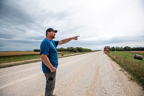 MIKAELA MACKENZIE / FREE PRESS
Dustin Wiens, a grain farmer south of La Salle, by the road closure of Floodway Road on Monday, Aug. 25, 2025. The road, which is closed now through to October, will impact the way that he transports his harvest from the fields.
For Aaron story.
Free Press 2025
