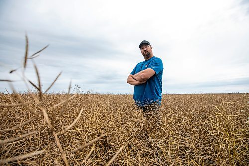 MIKAELA MACKENZIE / FREE PRESS
Dustin Wiens, a grain farmer south of La Salle, in his canola field by the road closure of Floodway Road on Monday, Aug. 25, 2025. The road, which is closed now through to October, will impact the way that he transports his harvest from the fields.
For Aaron story.
Free Press 2025